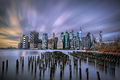 Long exposure of clouds over Lower Manhattan, the East River and the pilings near Brooklyn Bridge Park-2023-DRFlickr.jpg