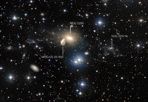 The surroundings of the interacting galaxy NGC 5291 (annotated).jpg